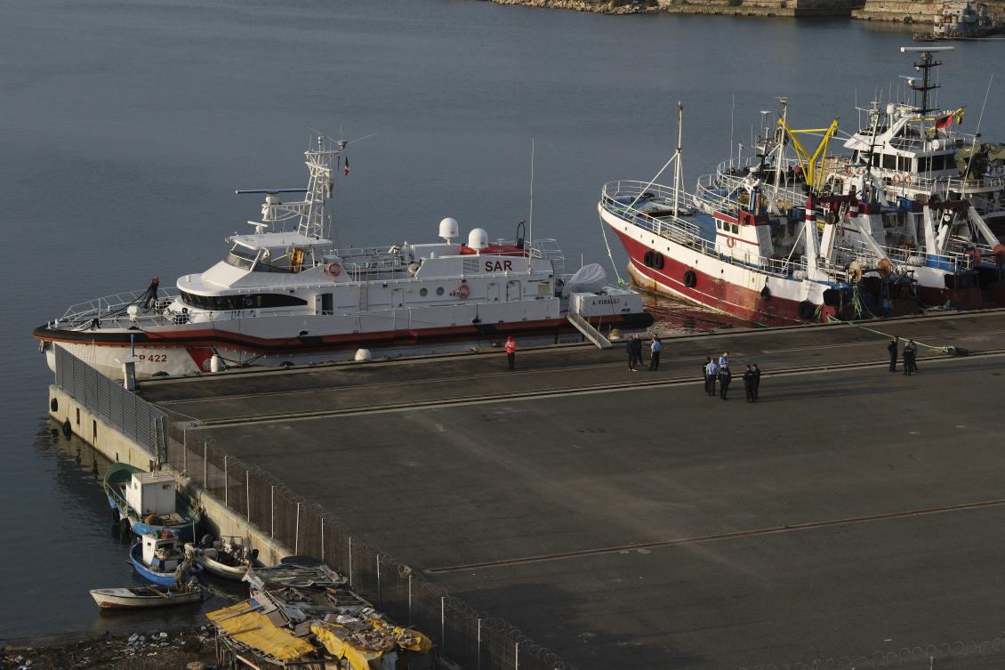 An Italian coast guard vessel prepares to depart from the port of Shengjin, Albania, to Italy, carrying 12 of 16 migrants intercepted in international waters and sent to the two reception facilities in Albania earlier this week after a court in Rome rejected their detention, on Saturday, Oct, 19, 2024. (AP)