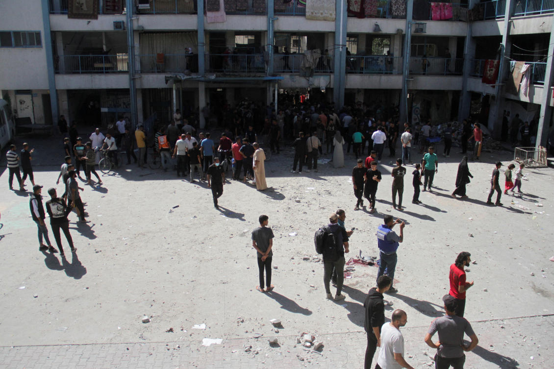 Palestinians inspect the site of an Israeli strike on a school sheltering displaced people, amid the ongoing Israel-Hamas conflict, at Beach refugee camp in Gaza City October 19, 2024. REUTERS/Mahmoud Issa