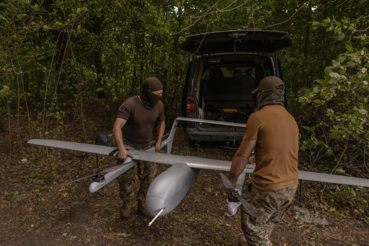 A file photo taken on August 11, 2024, shows Ukrainian military drone operators preparing a Poseidon reconnaissance unmanned aerial vehicle on their position, in the Sumy region, near the border with Russia, amid the Russian invasion of Ukraine. (AFP)