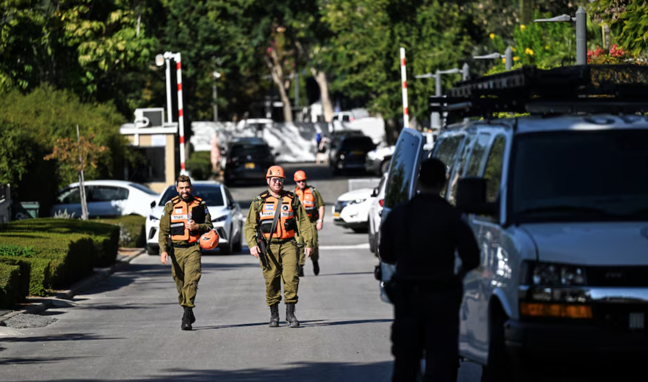 Israeli Home Front Command soldiers walk down a street in Caesarea, Israel on October 19, 2024 following a drone attack from Lebanon towards Israel amid ongoing hostilities between Hezbollah and Israel. (REUTERS)