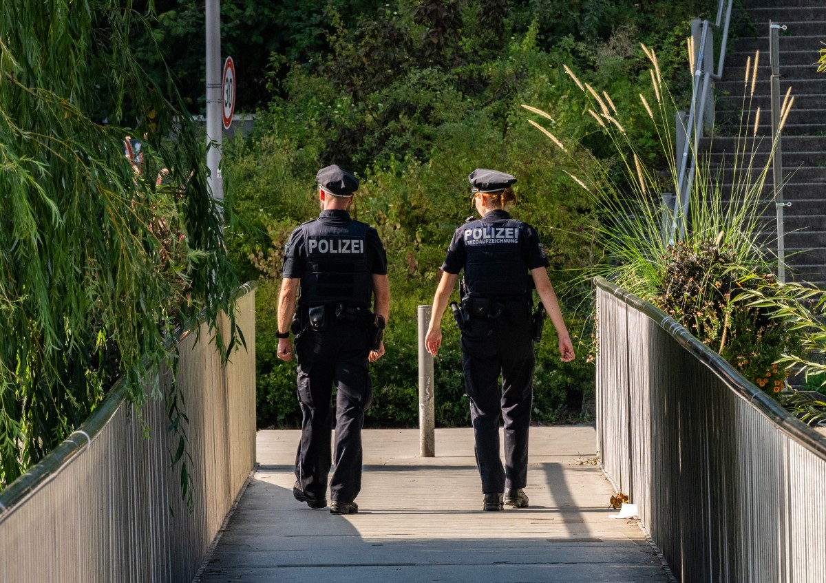 File photo of German police officers cross a small bridge as they patrol (AFP)