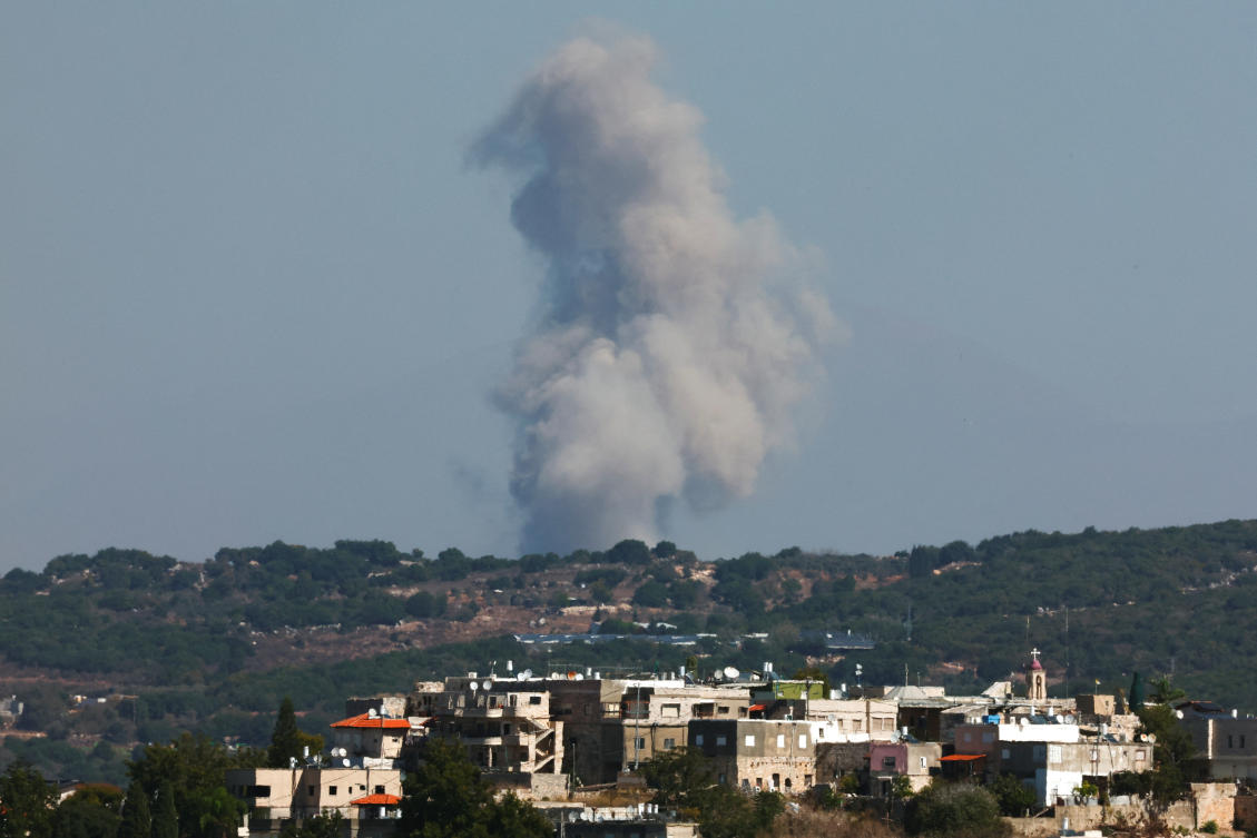 Smoke billows over Ayta ash Shab, southern Lebanon, as seen from northern Israel, October 20, 2024. (Reuters)