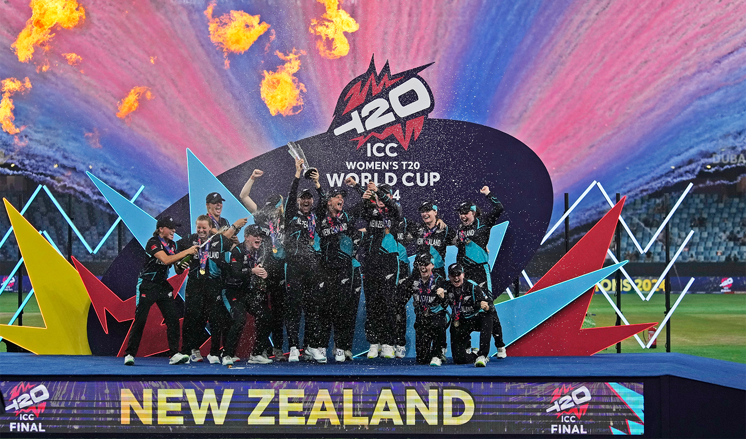 New Zealand's players pose with the trophy after winning the ICC Women's T20 World Cup 2024 final match against South Africa at Dubai International Cricket Stadium, United Arab Emirates, on October 20, 2024. (AP)