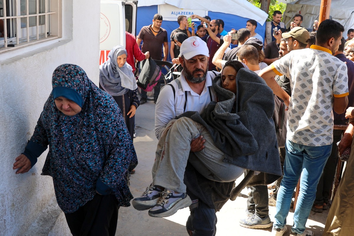 People who were injured during an Israeli operation in the Jabalia refugee camp in the central Gaza Strip arrive at Al-Ahli Arab hospital, also known as the Baptist hospital in Gaza City on October 21 (SPA