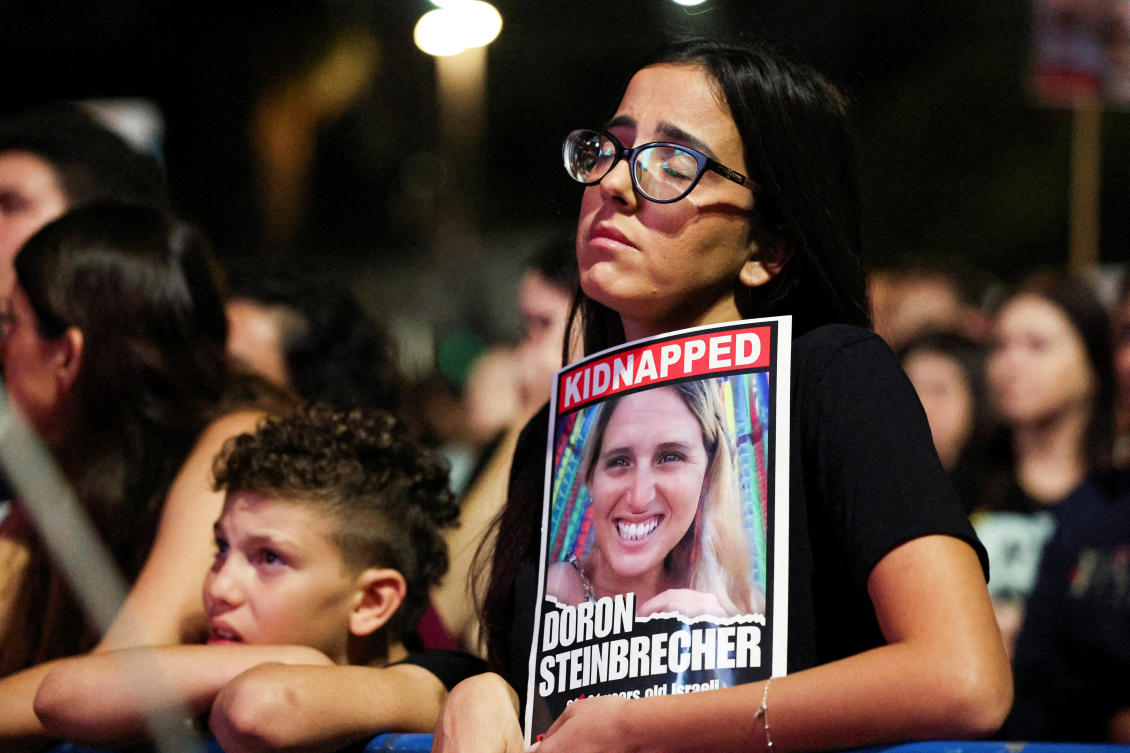 A woman holds a picture of one of the hostages as she attends a rally in support of hostages kidnapped during the deadly October 7, 2023 attack by Hamas, asking for their release, in Tel Aviv, Israel. (File/Reuters)
