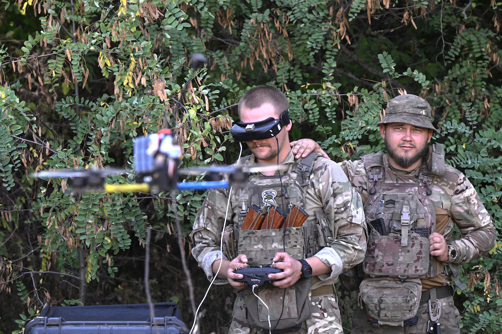 Ukrainian servicemen conduct a training flight with a first-person view drone at an undisclosed location on Aug. 23, 2024. (AFP)