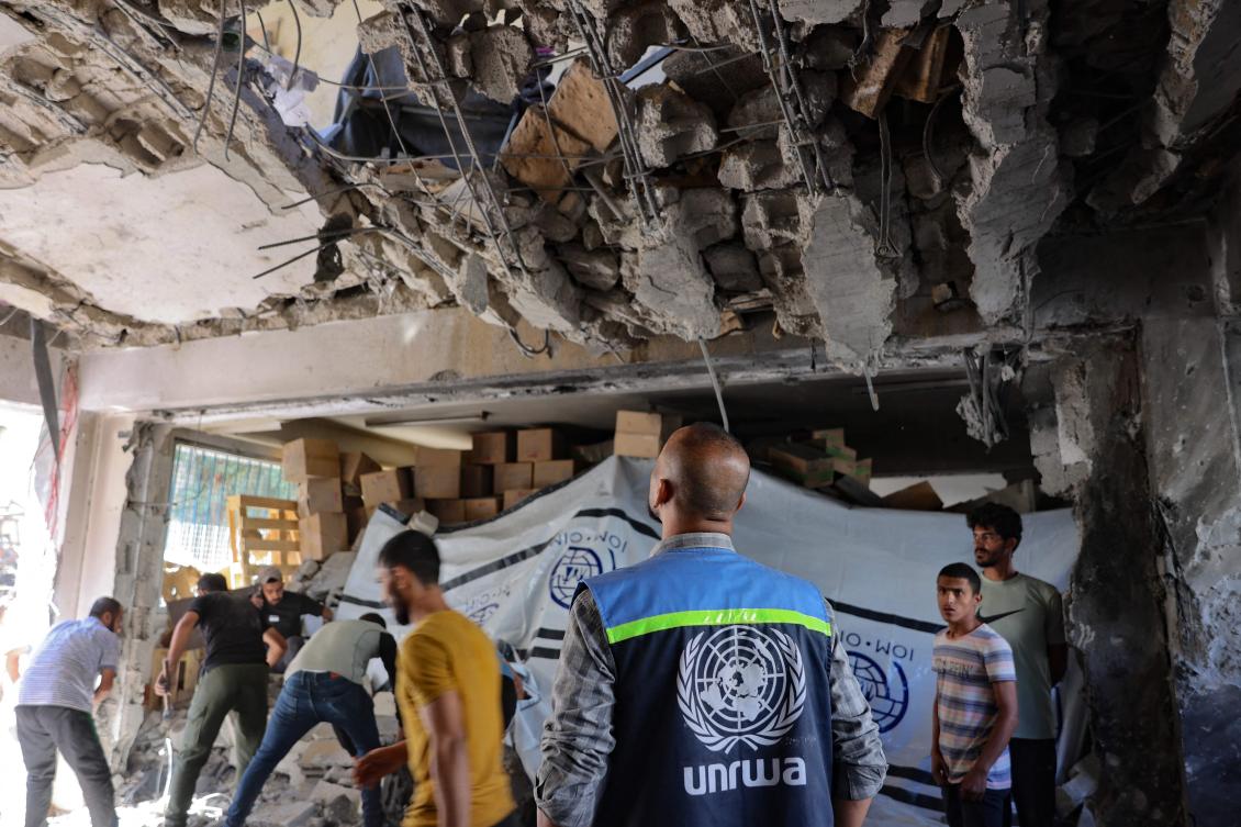 UNRWA worker and displaced Palestinians check the damage inside a UN school-turned-refuge in the Al-Shati refugee camp near Gaza City in the northern Gaza Strip. (File/AFP)