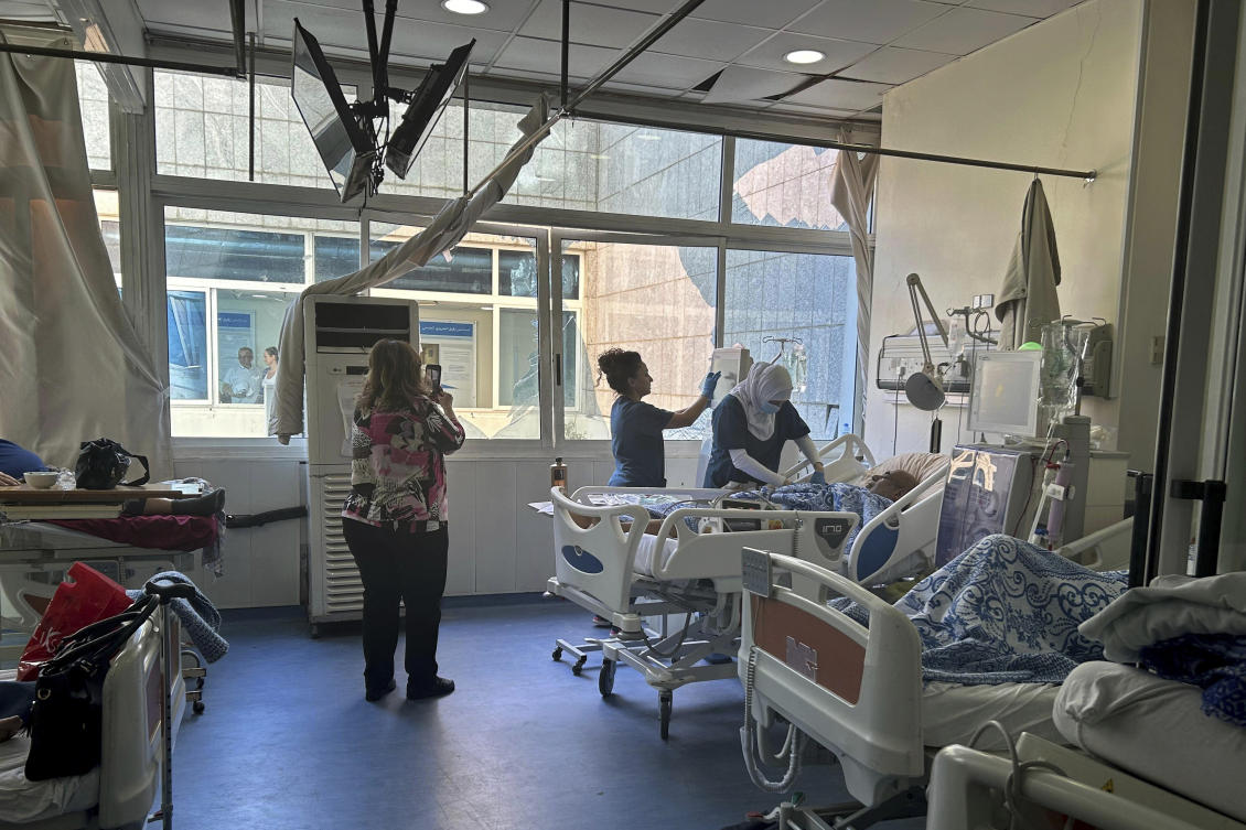 Patients receive treatment in the dialysis unit, near a broken window, of Rafik Hariri University Hospital, following an overnight Israeli airstrike, Beirut, Lebanon, Tuesday, Oct. 22, 2024. (AP Photo)