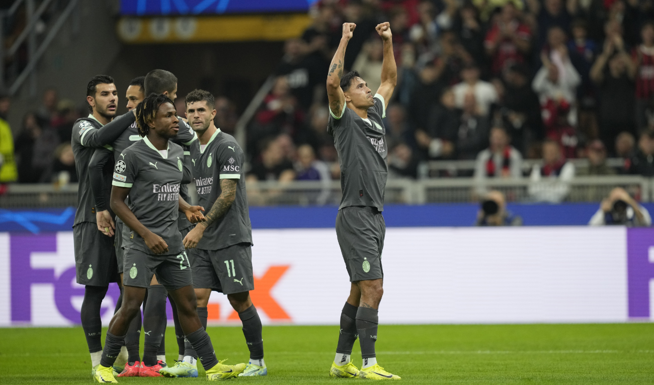 AC Milan's Tijjani Reijnders, right, celebrates after scoring his side's second goal during the Champions League opening phase soccer match between AC Milan and Club Brugge at the San Siro stadium in Milan, Italy, Tuesday, Oct. 22, 2024. (AP)