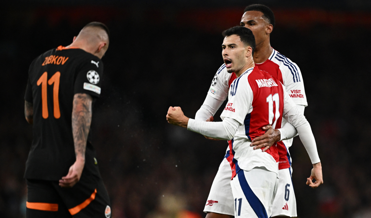 Arsenal's Gabriel Martinelli and Gabriel Magalhaes celebrate their first goal, an own goal scored by Shakhtar Donetsk's Dmytro Riznyk, during the Arsenal v Shakhtar Donetsk match at the Emirates Stadium, London, Britain on October 22, 2024 (Reuters)