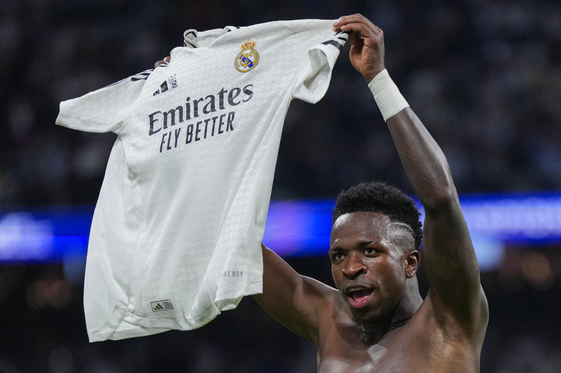 Real Madrid’s Vinicius Junior celebrates after scoring his side’s fourth goal during the Champions League opening phase soccer match between Real Madrid and Borussia Dortmund at the Santiago Bernabeu stadium in Madrid. (AP)