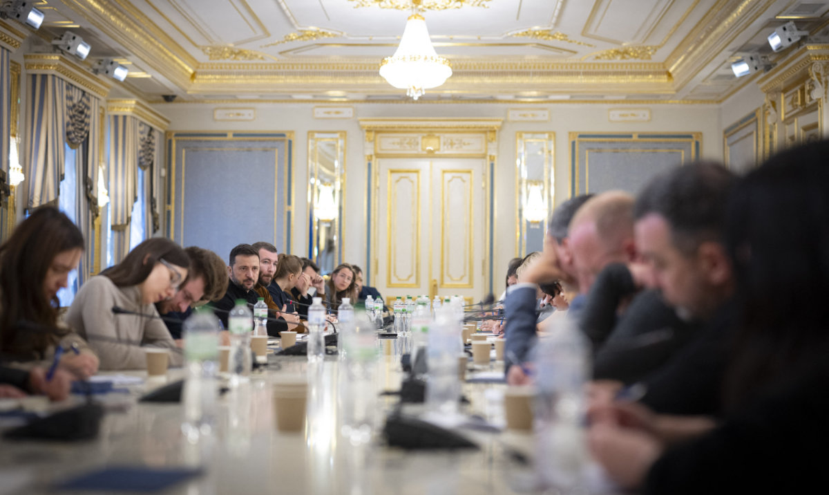 This handout photograph taken and released by the Ukrainian Presidential Press Service, shows Ukrainian President Volodymyr Zelensky (5thL) attending a meeting with Ukrainian and foreign reporters in Kyiv, on October 21, 2024. (AFP)