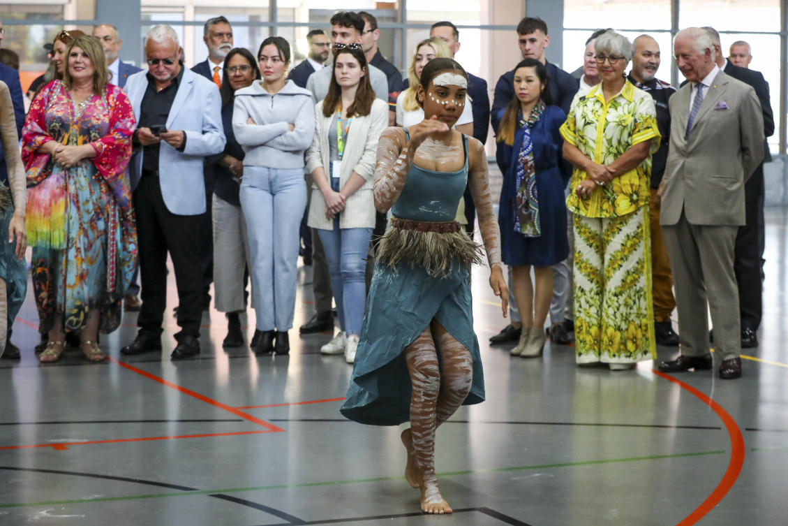 Britain’s King Charles III, right, watches a performance by the Brogla Dance Academy group during a visit to the National Center of Indigenous Excellence. (Pool Photo via AP/FILE)