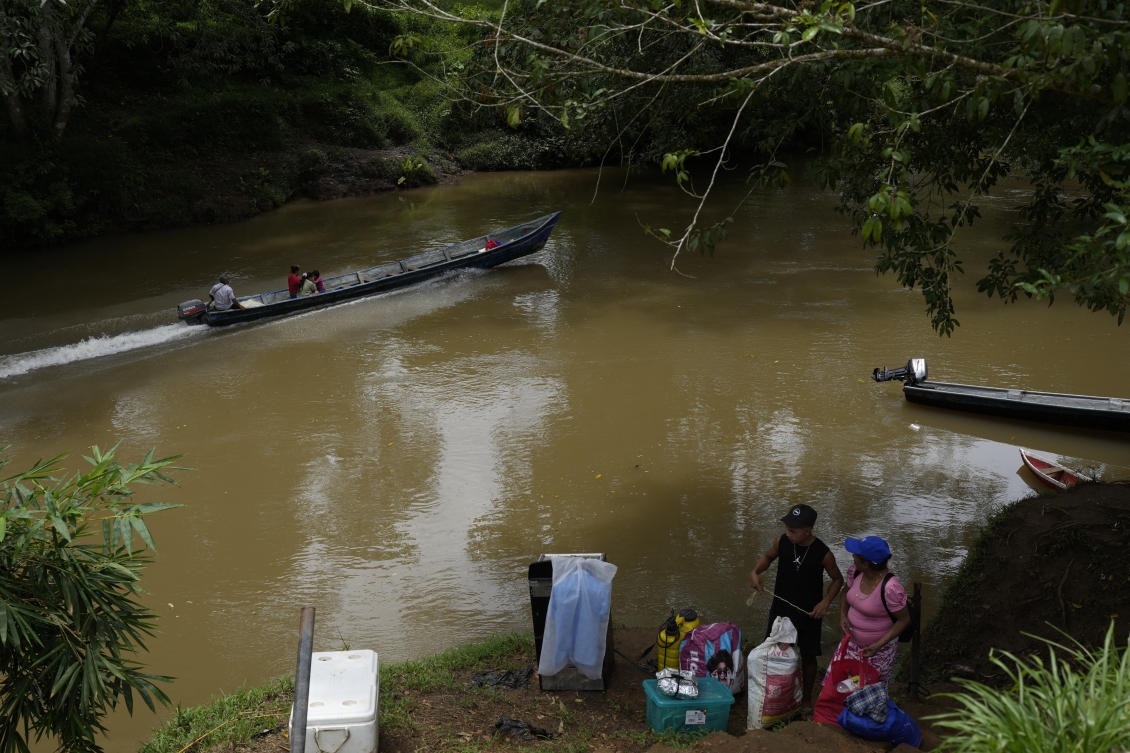 Above, locals commute along the Indio River near El Jobo village in Panama. El Jobo could lose reliable access to water under a proposed plan to dam the river to secure the Panama Canal’s uninterrupted operation. (AP)
