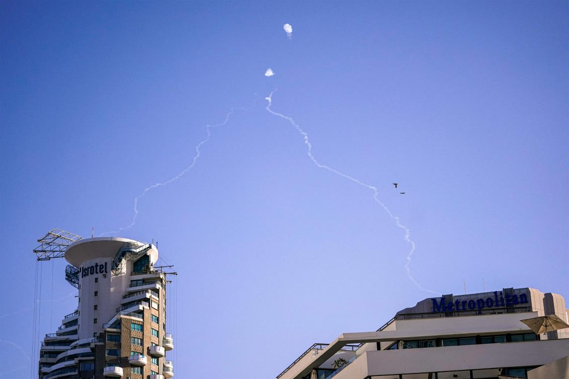 Above, Israel’s Iron Dome missile defense system intercepts incoming projectiles over Tel Aviv on Oct. 23, 2024. (AFP)