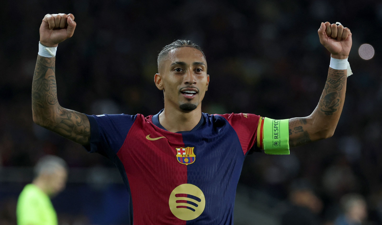 Barcelona's Brazilian forward #11 Raphinha celebrates scoring his team's third goal during the UEFA Champions League, league phase day 3 football match between FC Barcelona and FC Bayern Munich at the Estadi Olimpic Lluis Companys in Barcelona on October 23, 2024. (AFP)
