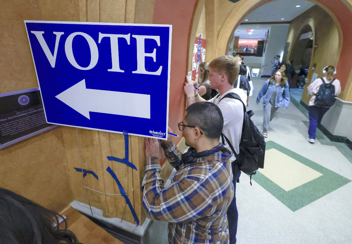 Students at The University of Wisconsin-Madison fill out ballots during the first day of Wisconsin's in-person absentee voting on the campus in Madison, Wisconsin, on Oct. 22, 2024. (Wisconsin State Journal/AP)