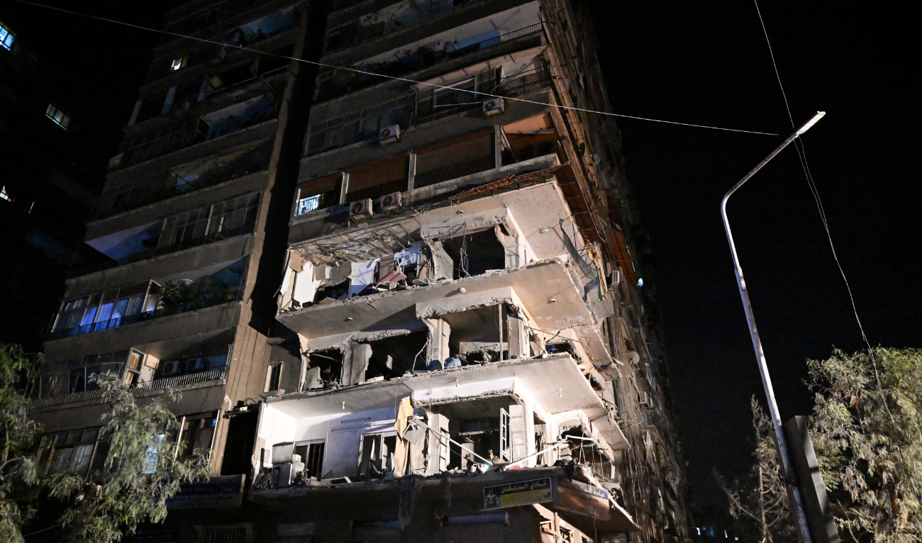 This picture shows a view of a residential building hit by a reported Israeli air strike, in the Mazzeh suburb on the western outskirts of Syria's capital Damascus on October 8, 2024. (AFP/File)