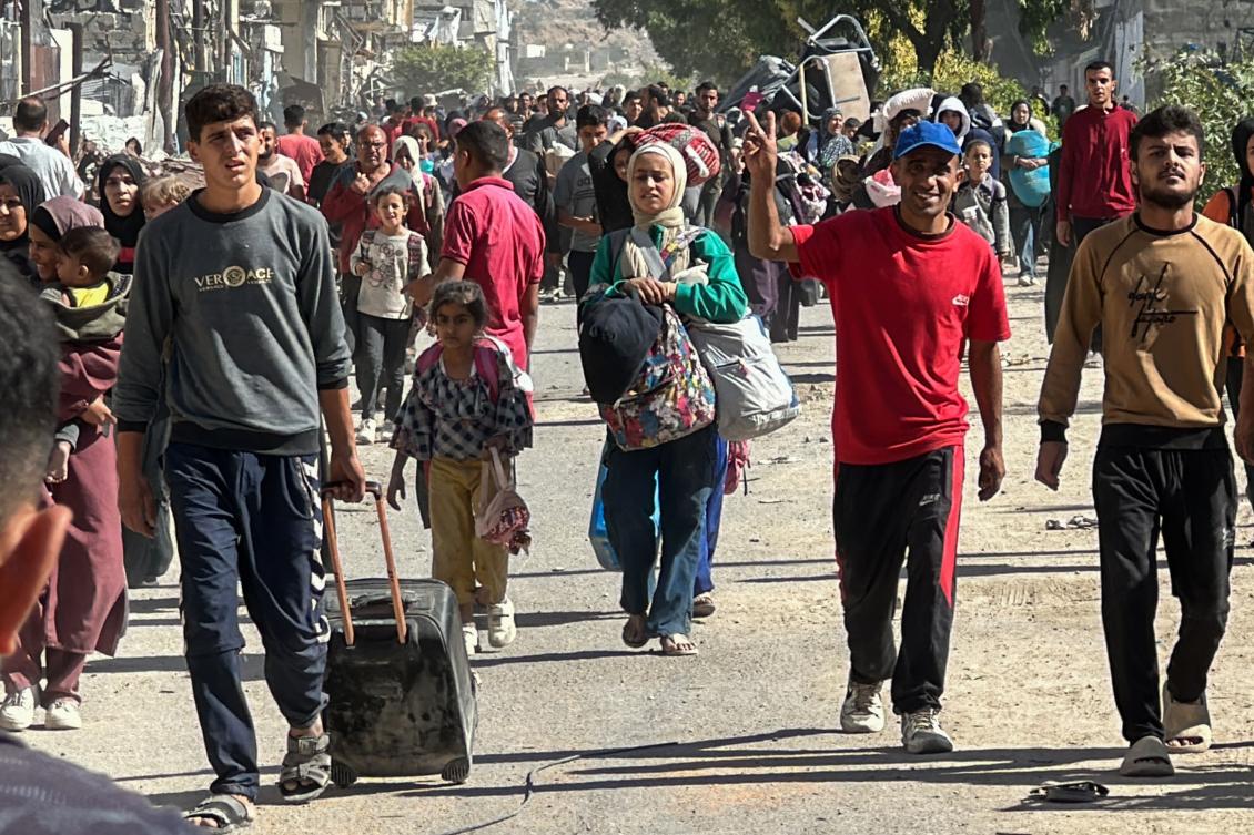 Displaced families fleeing Israeli army operations in Jabalia in northern Gaza take the main Salah Al-Din road toward Gaza City on Oct. 23, 2024. (AFP)