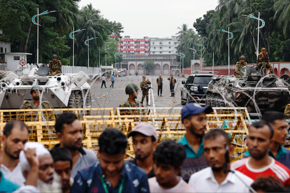Bangladeshi security personnel stand guard in front of the residence and workplace of President Mohammed Shahabuddin after protesters demanded his resignation, in Dhaka, Oct. 23, 2024. (Reuters)