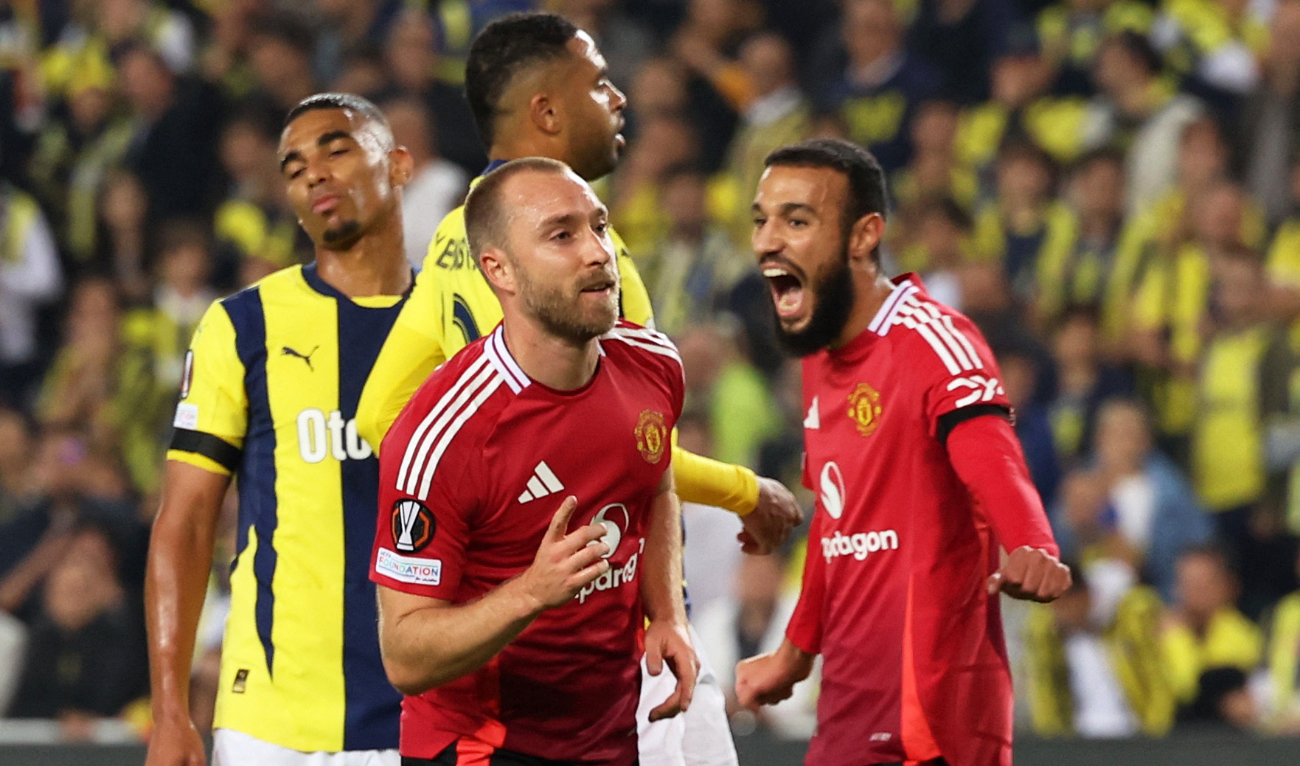 Manchester United's Christian Eriksen celebrates scoring their first goal with Manchester United's Noussair Mazraoui. (Reuters)
