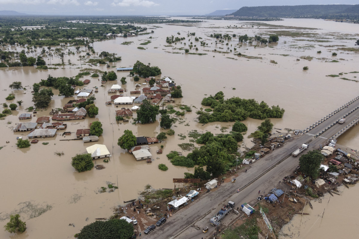 This areal view shows houses submerged by water in a flooded area in Adaha, Nigeria, on October 22, 2024. (AFP)