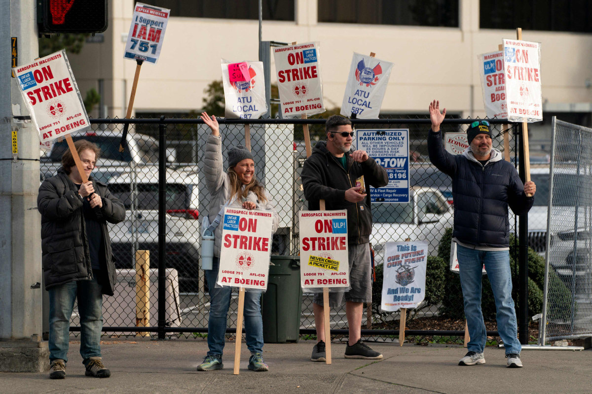 Boeing workers gather on a picket line near the entrance to a Boeing facility during an ongoing strike on October 24, 2024 in Seattle, Washington. (Getty Images/AFP)