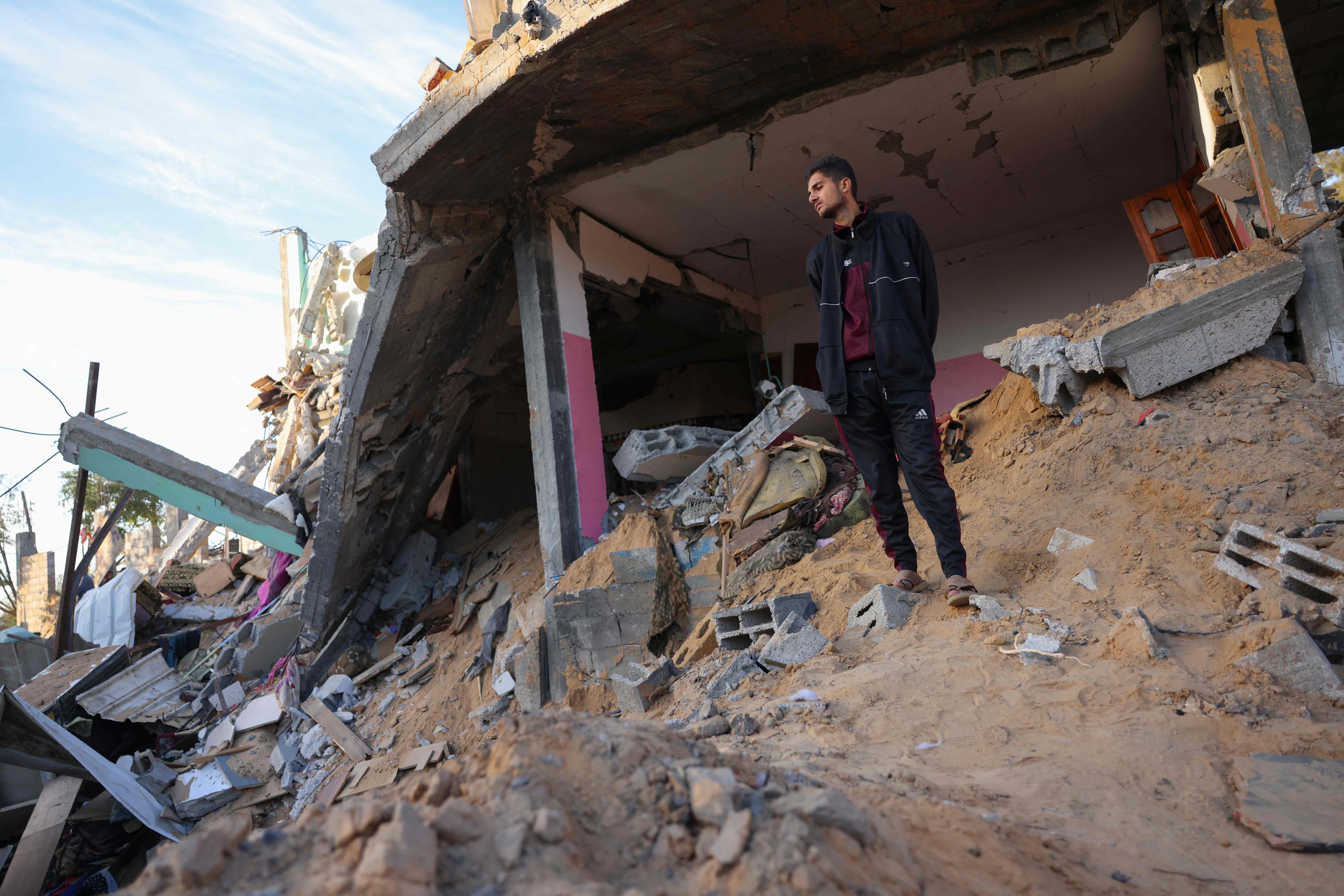 A man inspects the damage at the site of an Israeli strike that targetted an area in Khan Yunis on the southern Gaza Strip on October 25, 2024. (AFP)