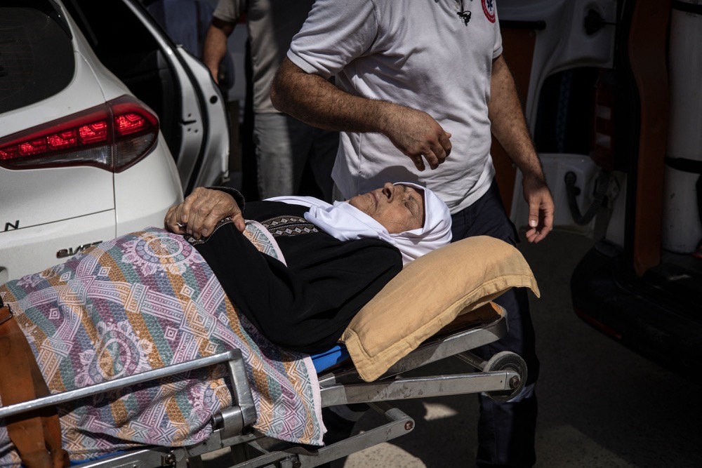 A patient needing kidney dialysis is taken to hospital in an ambulance in Jenin in the Israeli occupied West Bank. (AFP)