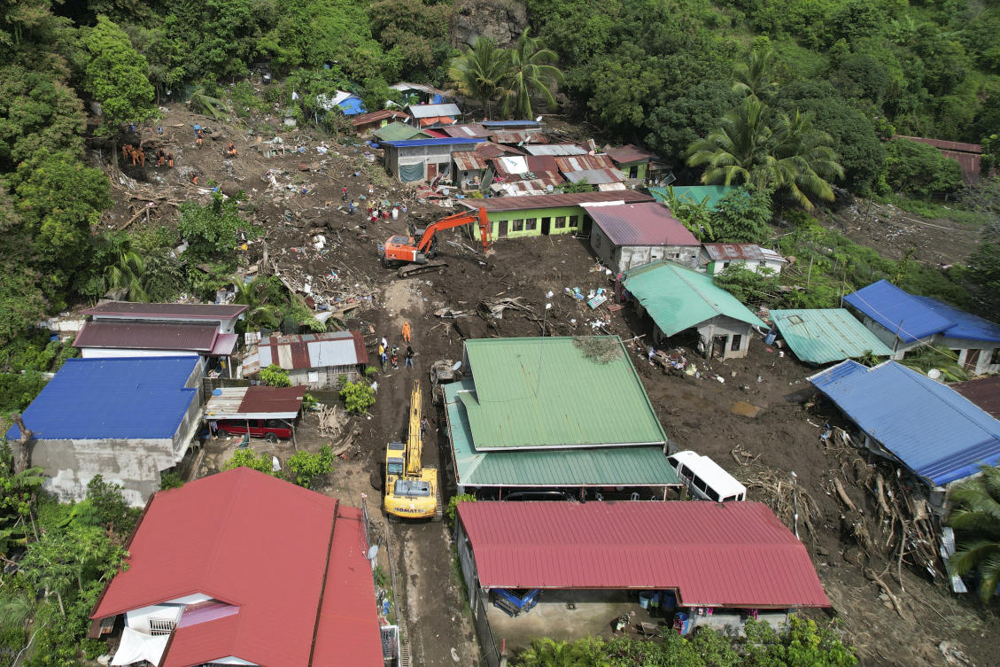 Rescuers search for bodies after a landslide triggered by Tropical Storm Trami struck homes in Talisay, Batangas province, Philippines on Oct. 26, 2024. (AP)