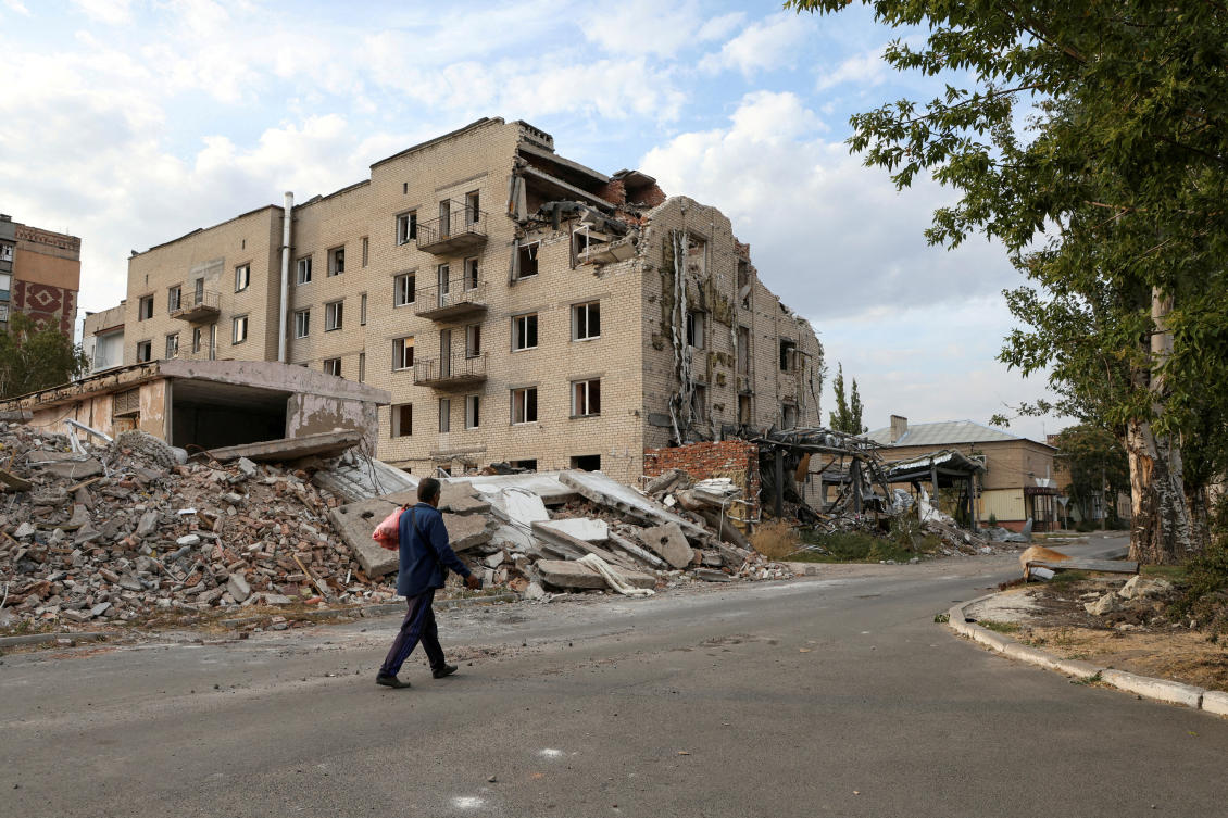A man walks past a building damaged by a Russian military strike in seen in the town of Pokrovsk, amid Russia's attack on Ukraine, in Donetsk region, Ukraine September 17, 2024. (Reuters)