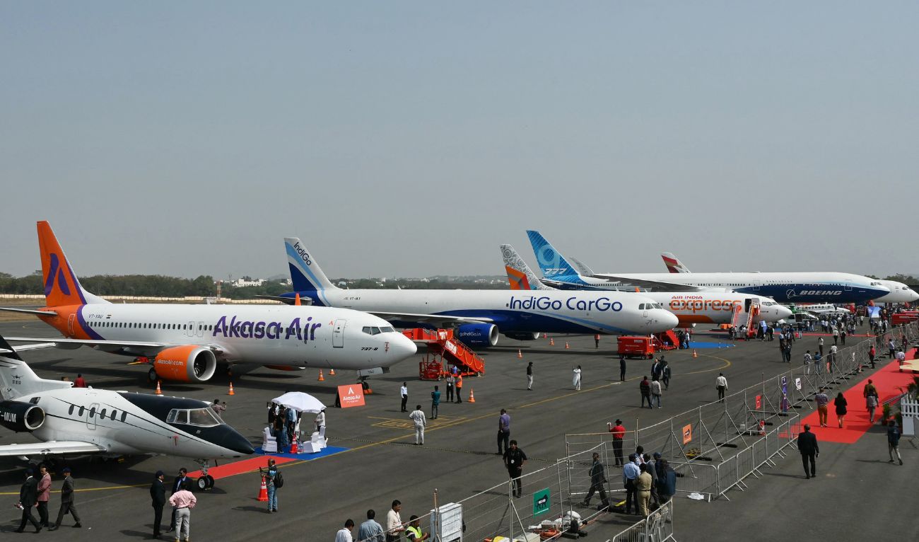 Visitors gathered near the airline aircrafts displayed during the 'Wings India 2024', an exhibition and conference on civil aviation, at the Begumpet Airport in Hyderabad on January 18, 2024. (AFP/ File)