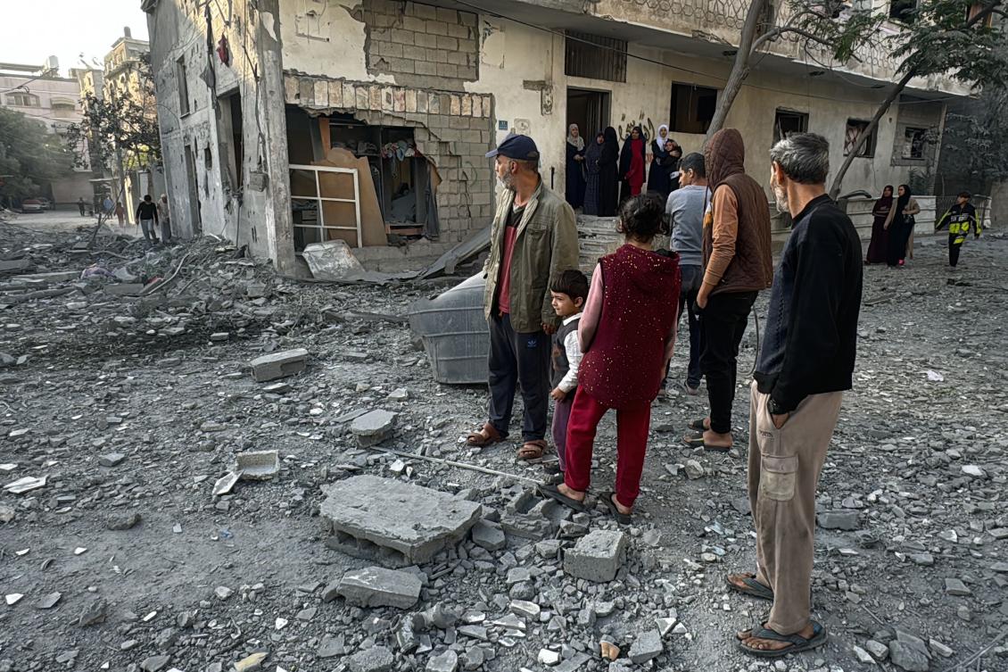 Palestinians inspect the damage after an overnight Israeli airstrike in Beit Lahia, the northern Gaza Strip, on October 27, 2024. (AFP)