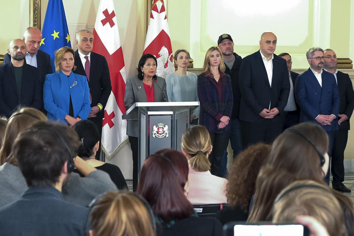 In this photo taken from video, Georgian President Salome Zourabichvili, center, surrounded by opposition leaders speaks to the media after the parliamentary election in Tbilisi, Georgia, on Sunday, Oct. 27, 2024. (AP)