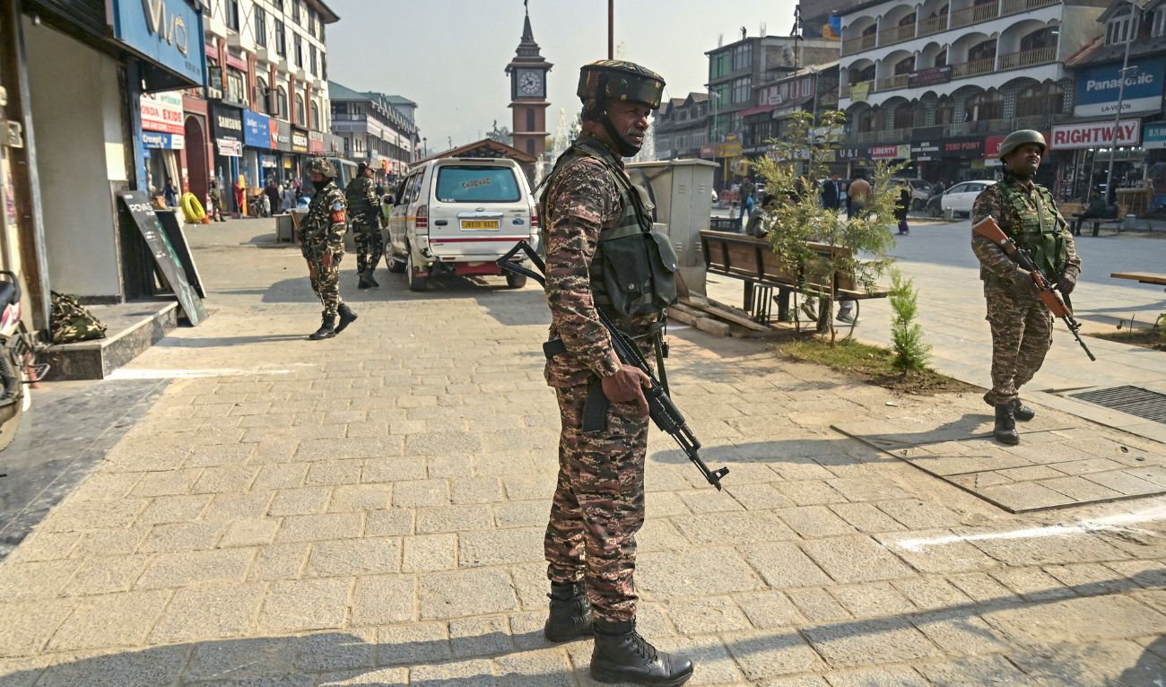 Indian security personnel stand guard along a road in Srinagar on October 25, 2024. (AFP/File)