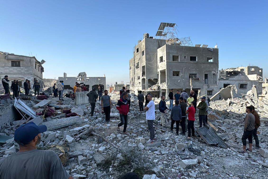Palestinians inspect the damage after an overnight Israeli airstrike in Beit Lahia, the northern Gaza Strip, on October 27, 2024. (AFP)