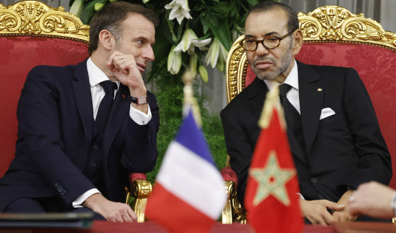 Morocco's King Mohammed VI (R) listens to France's President Emmanuel Macron during a signing ceremony in the Royal Palace in the capital Rabat on October 28, 2024. (AFP)