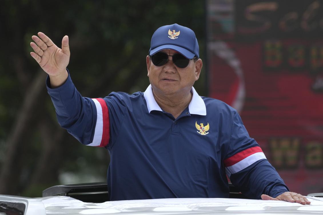 Indonesian President Prabowo Subianto waves as he leaves the Military Academy after a cabinet retreat in Magelang, Central Java, Indonesia. (File/AP)