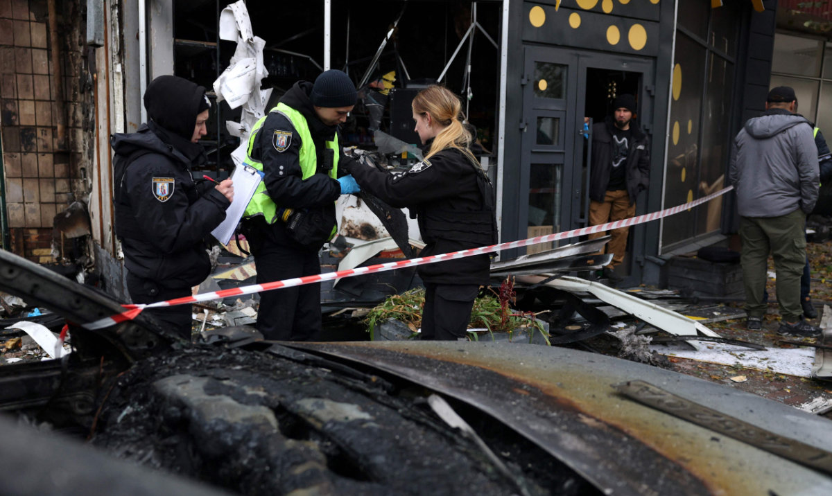Police officers collect evidences at the site of a Russian drone strike in Kyiv on October 29, 2024, amid the Russian invasion of Ukraine. (AFP)