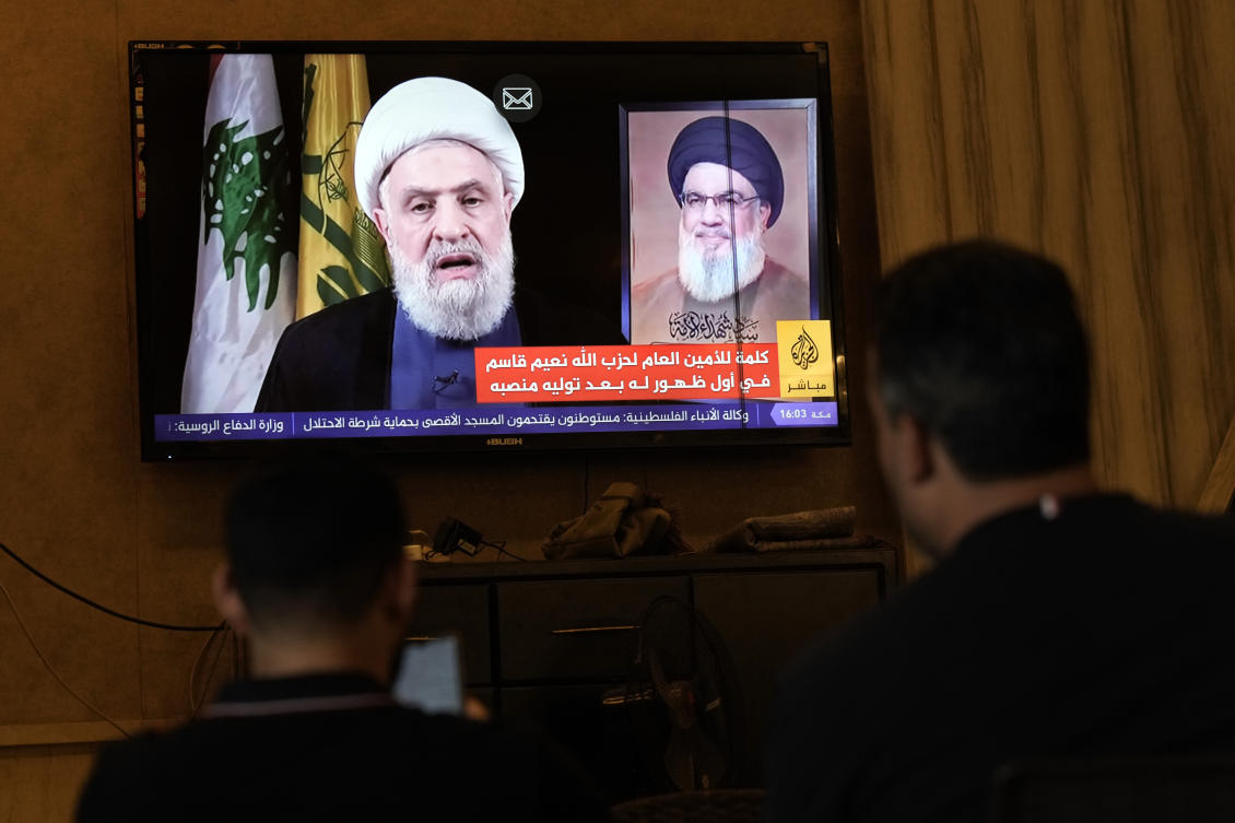 People watch Hezbollah’s newly named leader Naim Kassem delivering a televised speech, in the southern port city of Sidon, Lebanon, Wednesday, Oct. 30, 2024. (AP Photo)