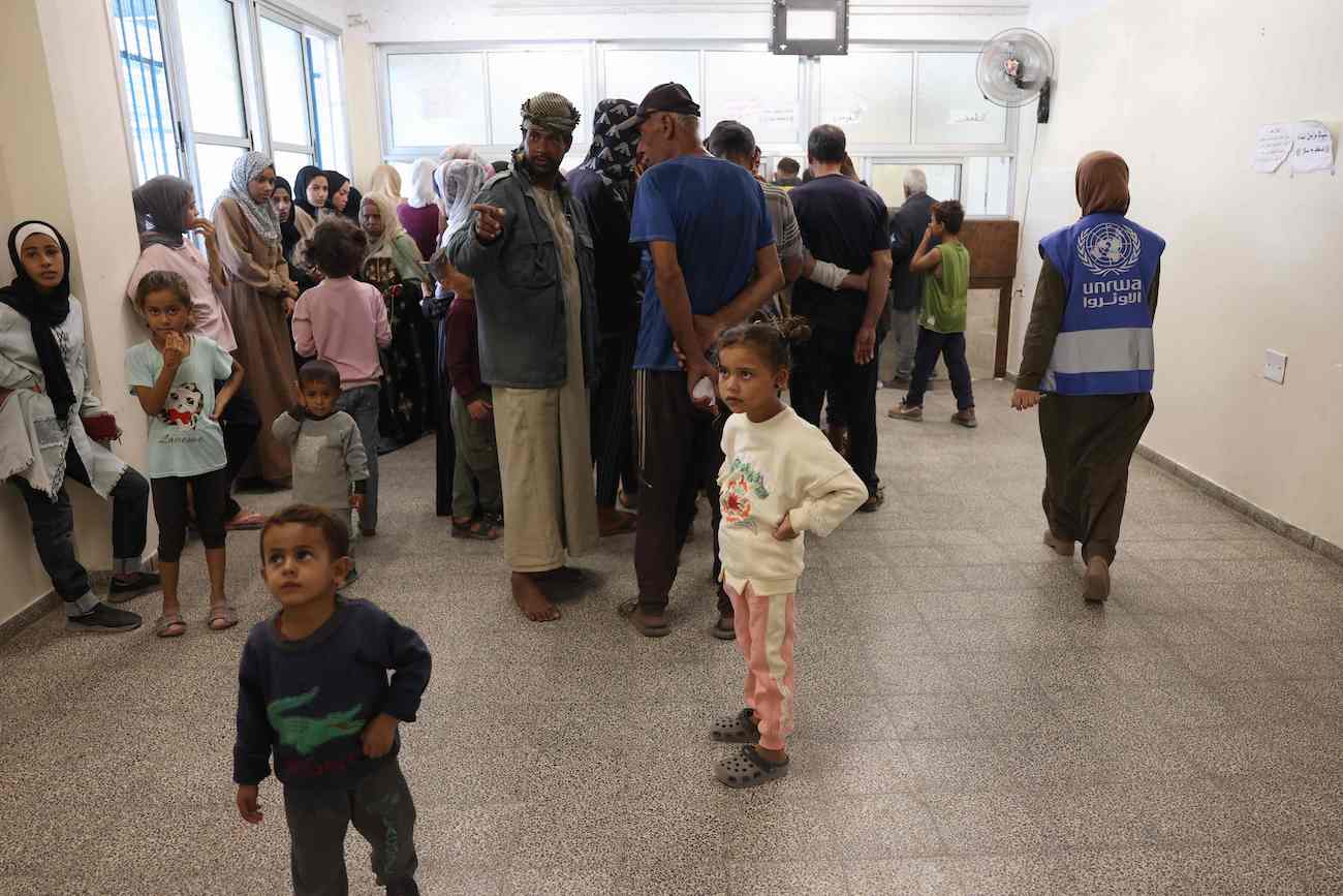 Palestinians wait their turn at the UNRWA Japanese Health Center in Khan Yunis on the southern Gaza Strip on October 29, 2024. (AFP)