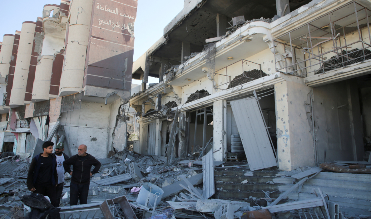 Palestinians inspect the site of an Israeli strike on a house in Khan Younis in the southern Gaza Strip on October 30, 2024. (Reuters)