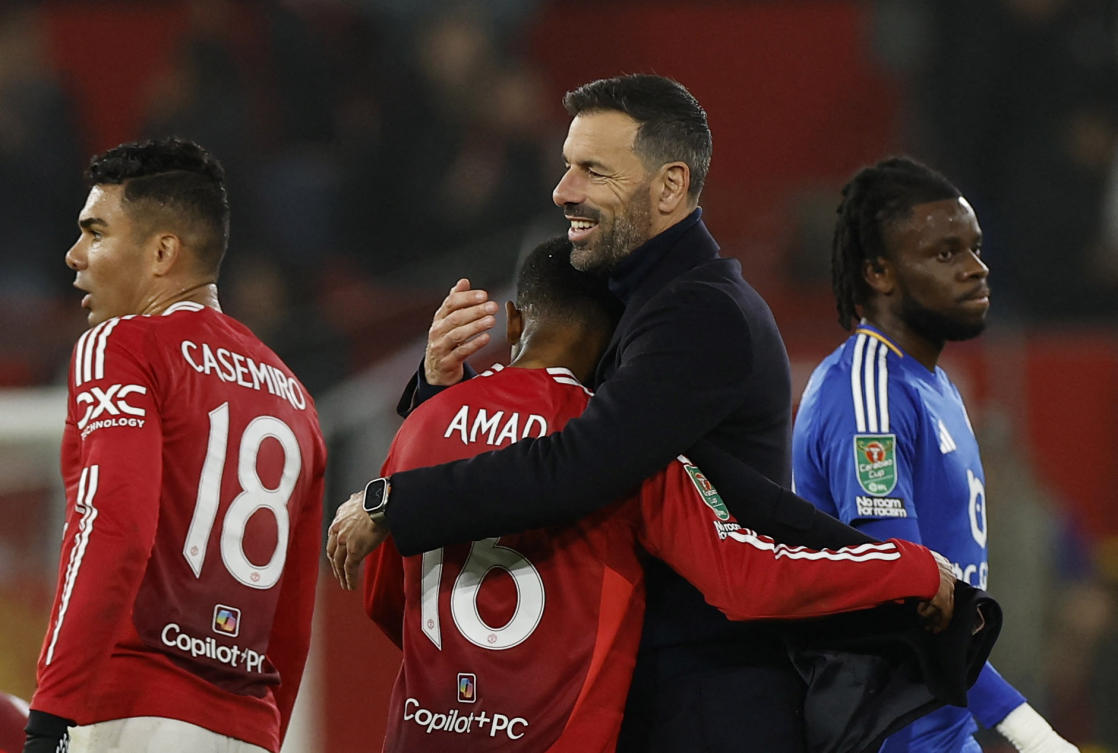 Manchester United interim manager Ruud van Nistelrooy celebrates with Amad Diallo after the match. (Action Images via Reuters)