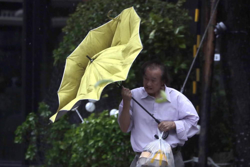 Typhoon Kong-rey slightly weakened overnight but remained powerful as the equivalent of a Category 4 hurricane packing gusts of more than 250 kph. (AP)