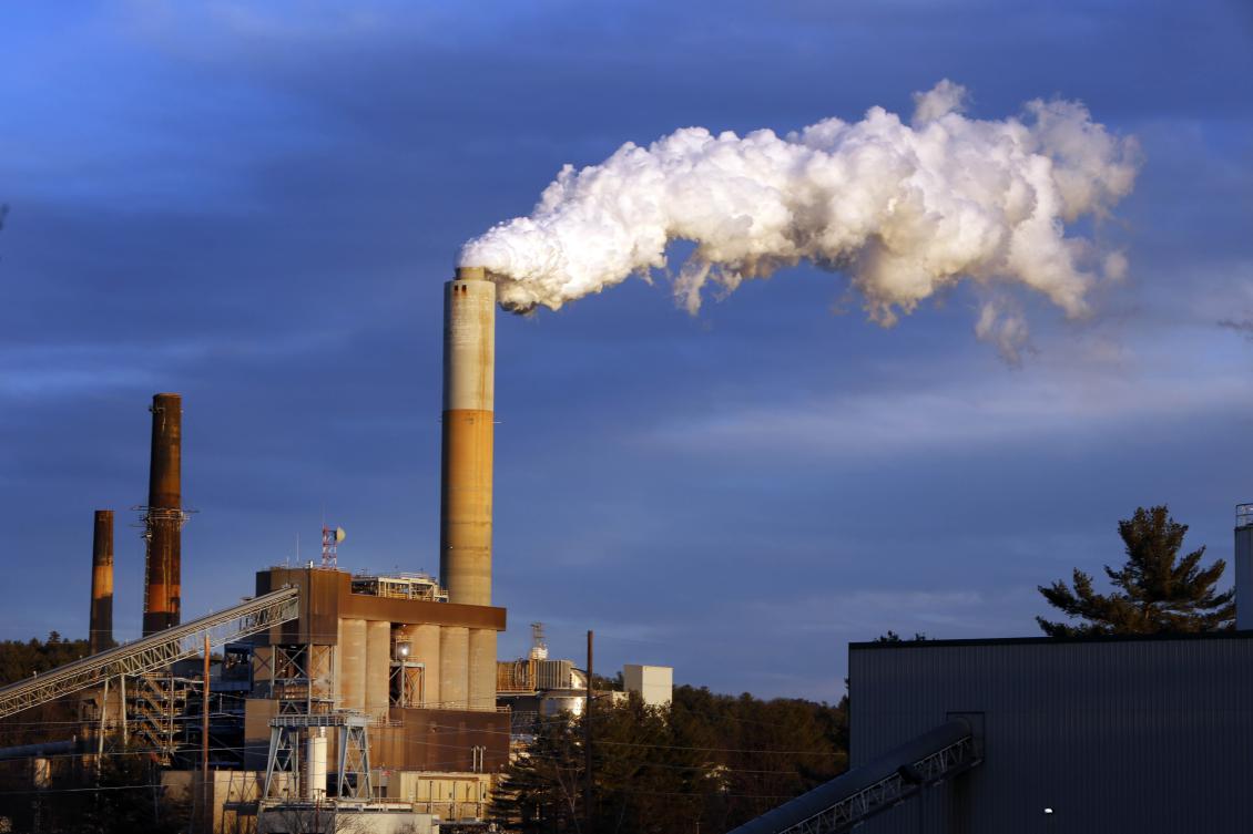 File photo, a plume of steam billows from the coal-fired Merrimack Station in Bow, N.H. If the nation doesn’t do more, the US probably won’t quite meet the dramatic heat-trapping gas reduction goal it promised in last years Paris agreement to battle climate change, according to a new study. (AP)