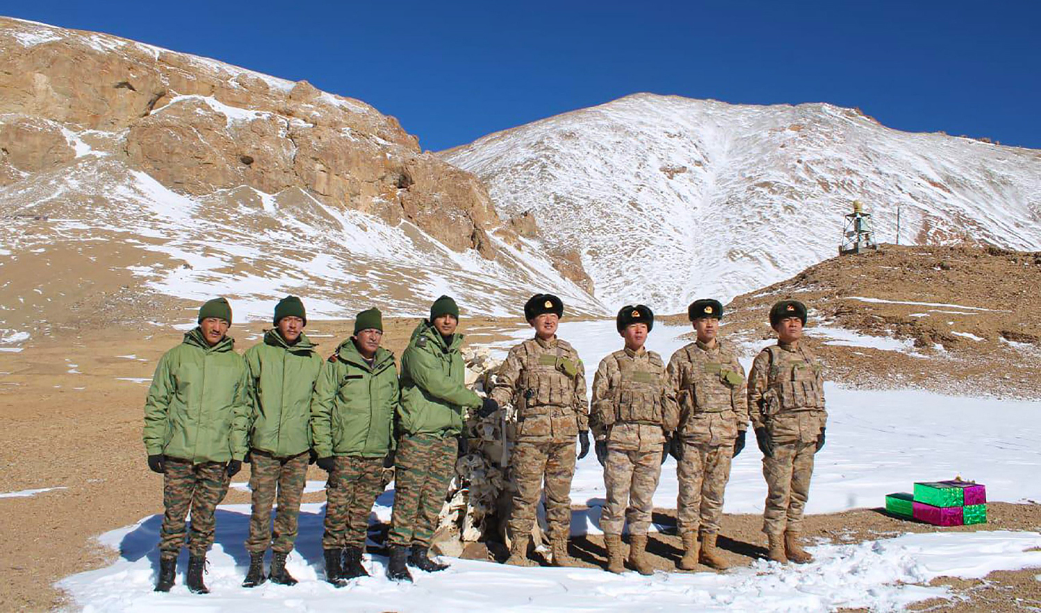 Indian and Chinese army greet each other along the Line of Actual Control (LAC) near Karakoram pass in Ladakh on October 31, 2024, on the occasion of Diwali. (Indian Army/AFP)
