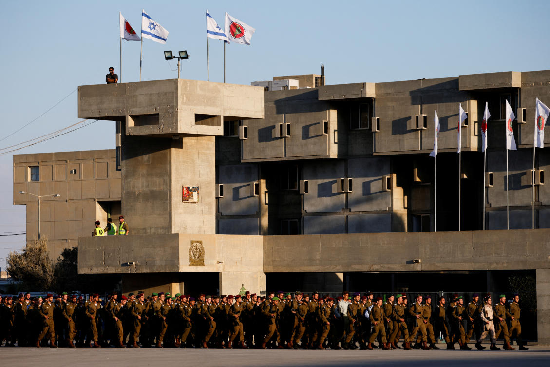 Israeli military members walk on the day of a ceremony for the 70th cohort of military combat officers, at an army base near Mitzpe Ramon, Israel. (Reuters)