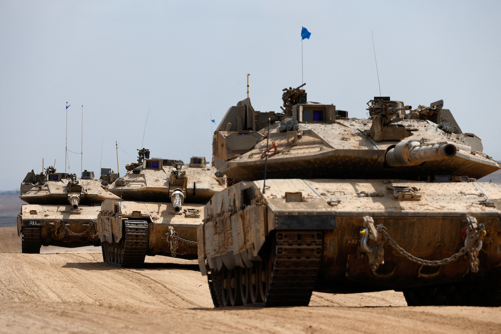 Israeli tanks make their way towards the border with the Gaza Strip. (AP)