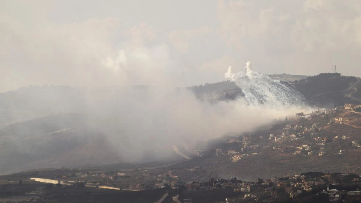 Smoke rises from the site of Israeli artillery shelling on the southern villages of Adeisseh and Kfar Kila along the border with Israel on October 1, 2024. (AFP)