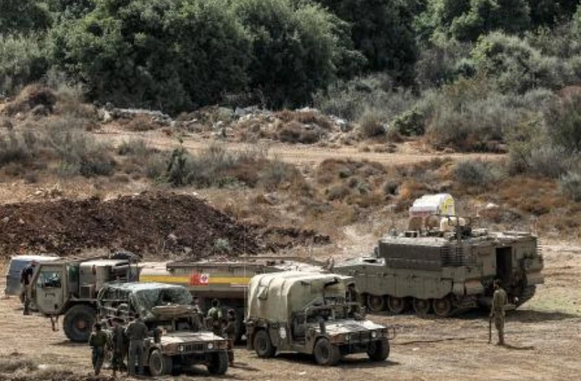 Israeli army vehicles deploy at a position along the border with Lebanon in northern Israel on Oct. 1, 2024. (AFP)